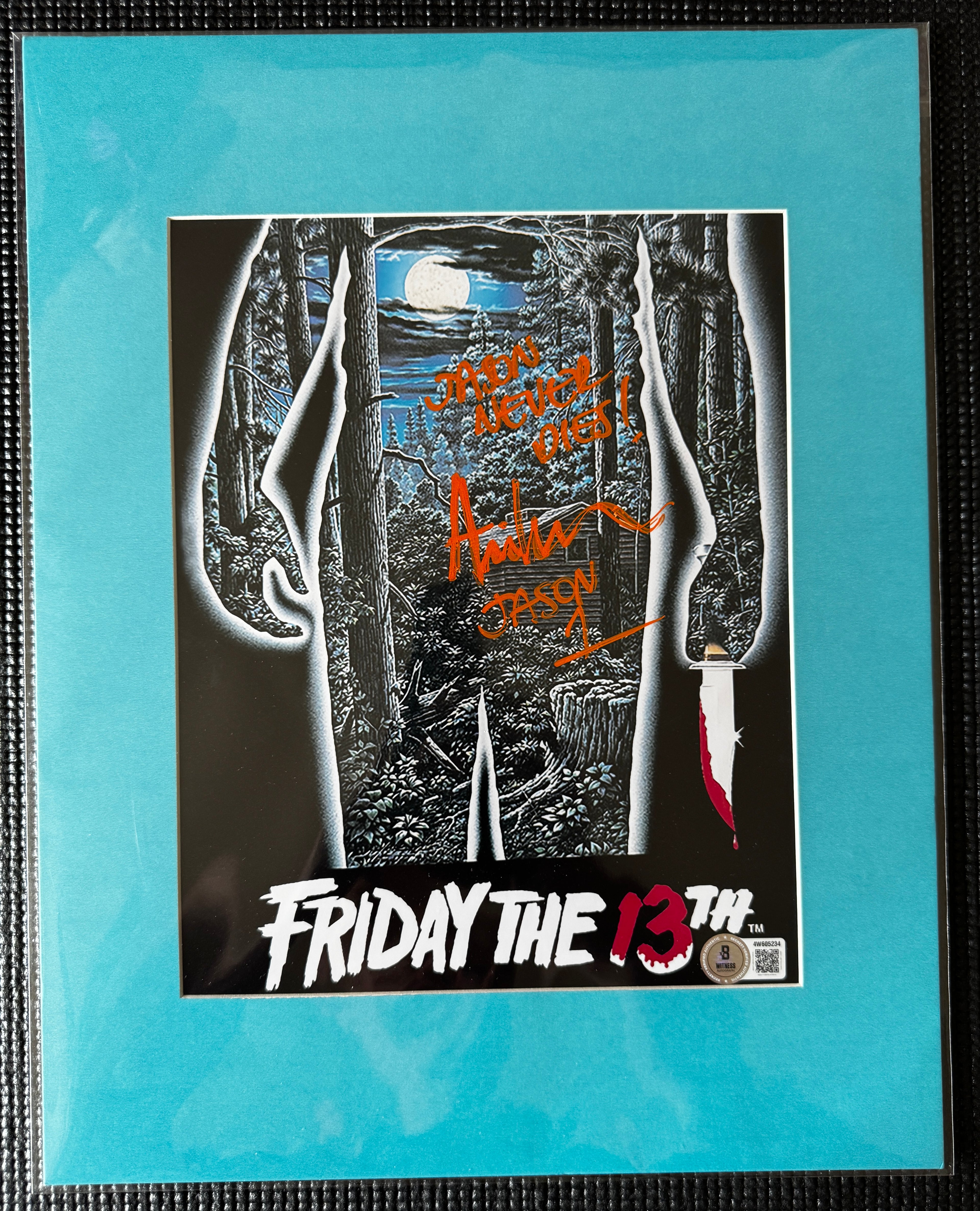 Friday the 13th Ari Lehman Autographed 8x10 Photo - "Jason Never Dies" Orange Ink, Cabin W/ Teal Matting Beckett/W